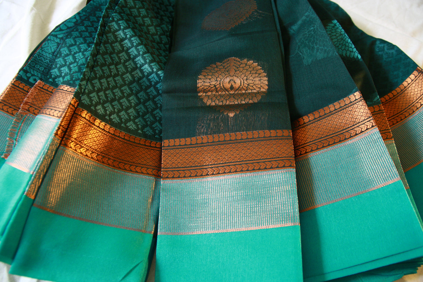 Dark Green Pure Cotton Saree with Aqua Blue and Copper Zari work