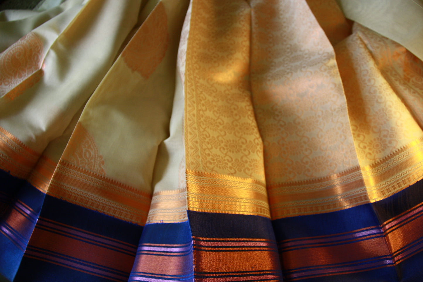 Cream Beige Cotton Saree with Deep Blue border and Light Copper work