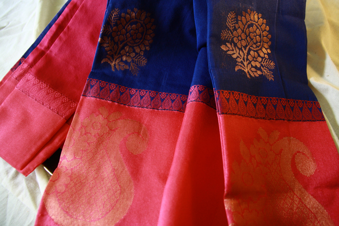 Peacock Blue Cotton Saree with Big Rose Pink Border and Golden work.